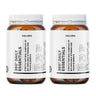 Zwei Flaschen Daluma 360 DAILY ESSENTIALS SUPPLEMENT DOUBLE mit weißen Etiketten und orangefarbenen Verschlüssen, nebeneinander auf weißem Hintergrund. Der Text auf dem Etikett ist verschwommen und unleserlich.